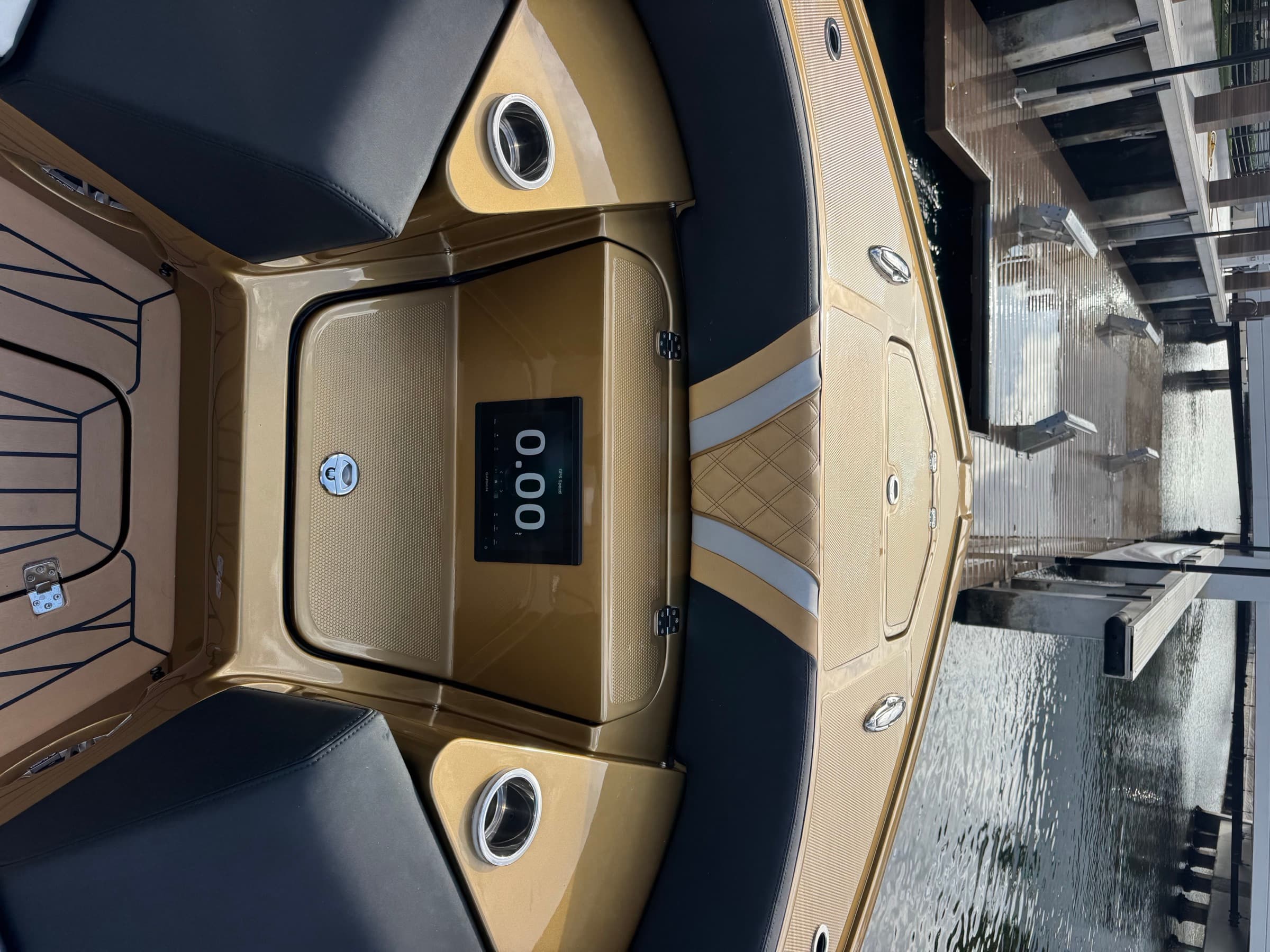 Gold diamond-stitched bow seating and forward Garmin display